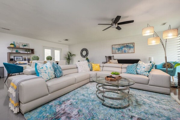 [Living Room] Open floor plan with lots of seating areas to view the 65" smart TV.