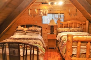 Loft sleeping area with 2 double beds