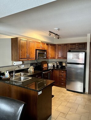 Fully equipped kitchen comes with toaster, coffee maker, crock pot, air fryer. 