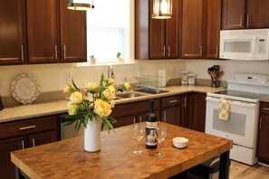 Cooking time sharing a glass of wine with friends
