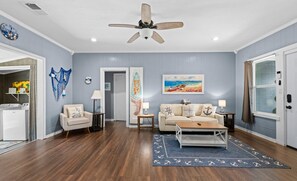 Newly remodeled living room has nautical theme