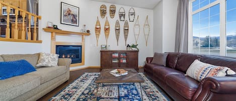 Family room with vaulted ceilings and open concept 