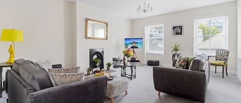 Beautifully presented lounge with two 2 seater sofas, cosy armchair and Smart TV