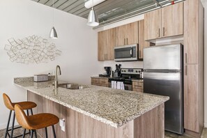 Enjoy cooking in this contemporary kitchen with all the essentials.