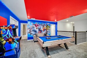 Dive into fun and adventure in our game room, complete with a pool table. Perfect for all ages, this space promises hours of entertainment and friendly competition.
