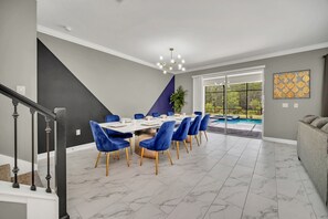 Gather around in our spacious dining area, perfect for accommodating the whole family. Enjoy delicious meals and engaging conversations in a comfortable and inviting setting.