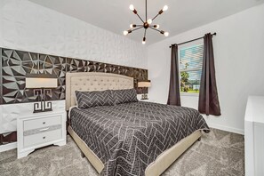 Indulge in the comfort of our master bedroom, featuring an ensuite bathroom and an impressive outside view.