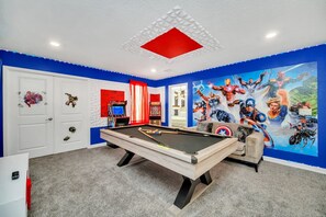 Unwind and have a blast in our game room equipped with a pool table
