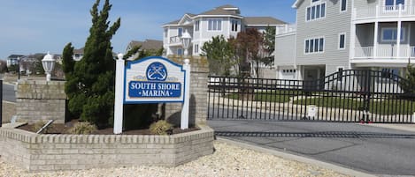 Entrance to the gated South Shore Marina with pool, tennis and marina.