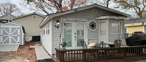 Front view of cottage and cart building