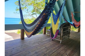 Relax in one of four upper patio hammocks!