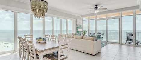 Living/Dining Room with amazing views of the Gulf. Electric blinds for privacy