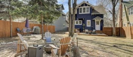 Private backyard area with hot tub, firepit and grilling area.