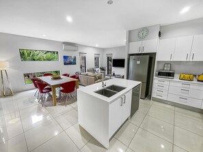 Fully equipped gourmet kitchen with modern appliances.