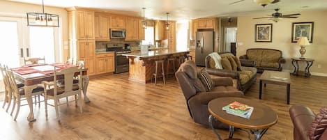 Spacious open living room with kitchen and dining area