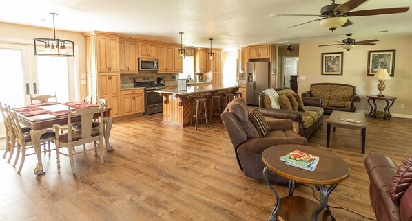 Spacious open living room with kitchen and dining area