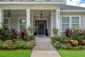 Beautiful front door entrance with rocking chairs on the Portch 
