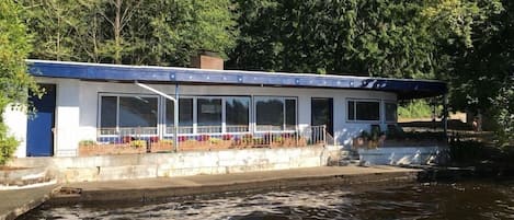 The view of the front of our home.  Over 50 feet of waterfront right out your front door!  We love sitting on the pavement and soaking our feet as we watch eagles circle overhead and fish jump!  Take in  the tranquil view of the lake anytime of year!