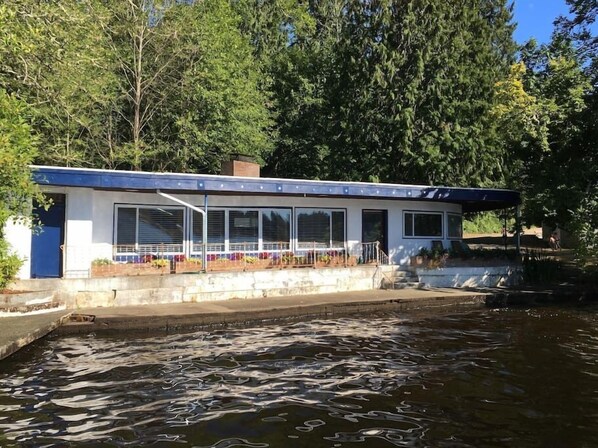 The view of the front of our home.  Over 50 feet of waterfront right out your front door!  We love sitting on the pavement and soaking our feet as we watch eagles circle overhead and fish jump!  Take in  the tranquil view of the lake anytime of year!