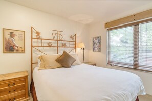 The primary bedroom features a queen bed.