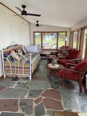 Front porch with daybed and seating 