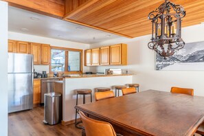 Fully equipped kitchen with barstool seating.