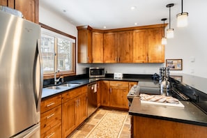 Convenient kitchen with modern appliances and plenty of prep space.