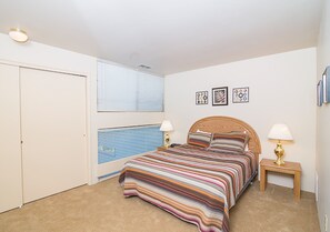 Primary bedroom features a queen bed.