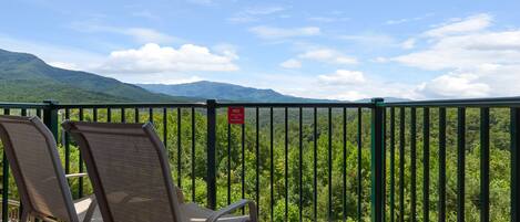Relax. Unwind. Reset. - The balcony of Deer Ridge E206 makes the perfect place to relax after a day in the mountains.