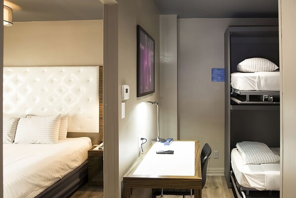 Unit with Queen and 2 Twin beds. Exact unit assigned upon arrival