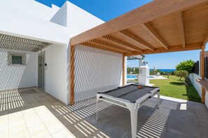 Enjoy a game of pool under the shade of the pergola