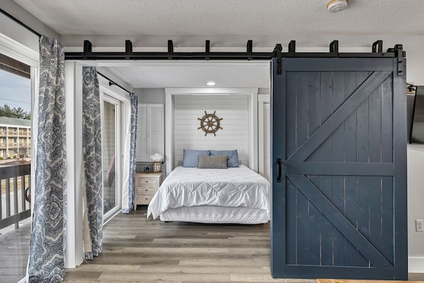 Queen bed, sliding barn doors for privacy from living room