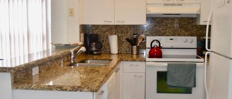 Equipped kitchen with granite counter tops