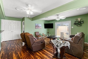 Family Room with rocking sofa chairs and smart TV