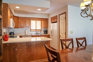 The condo has a full service kitchen with pantry.