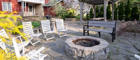 The outdoor space is truly picturesque with a large flagstone patio putting green and fire pit.