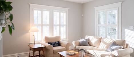 Sunny and relaxed describes the feel of the interior - woods floors, warm whites, comfortable and cozy.