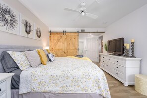 Barn door encloses the bedroom for easy sleeping in.