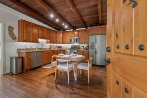 Step through the front door to the kitchen and dining area.