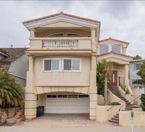 Street view. 2 car garage & 2 car driveway.  Balcony top floor and rooftop deck.