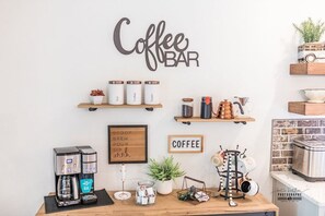 Stylish Coffee Bar for Morning Bliss Wake up to your perfect brew at this thoughtfully designed coffee bar. Equipped with everything you need, it's ideal for starting your day with comfort and style.