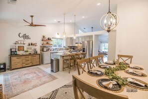 Open Dining and Coffee Bar Space Gather around the beautifully set dining table and enjoy the convenience of a curated coffee bar, perfect for creating cozy mornings or hosting memorable dinners.