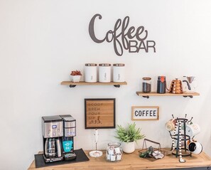 Stylish Coffee Bar for Morning Bliss Wake up to your perfect brew at this thoughtfully designed coffee bar. Equipped with everything you need, it's ideal for starting your day with comfort and style.