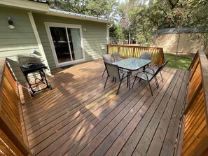 The roomy rear deck is a great spot to enjoy the tree covered view