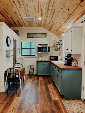 Long view of kitchen and eating area 