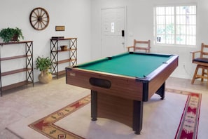 Enjoy the pool table open concept to the living room and kitchen