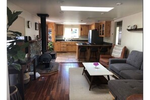 A view from the dining table area overlooking the dining room and kitchen area. 