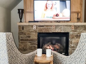 cozy chairs in front of the gas fireplace