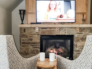 cozy chairs in front of the gas fireplace