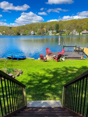Walk down from the patio to the dock fire pit and lake